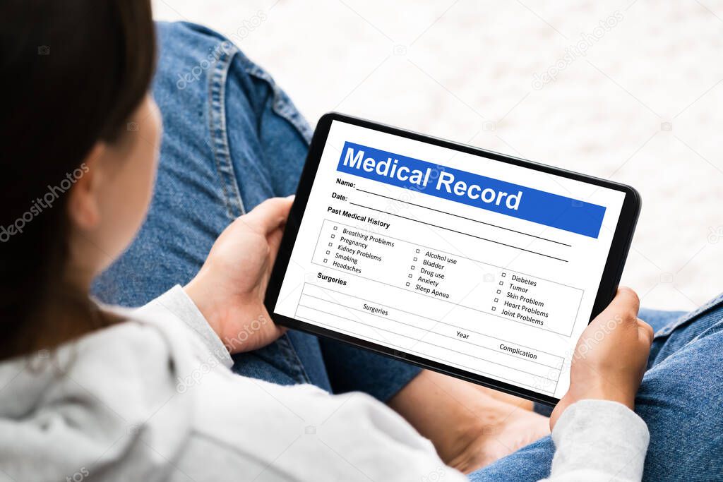 Woman Patient Using Hospital Record And Online Register