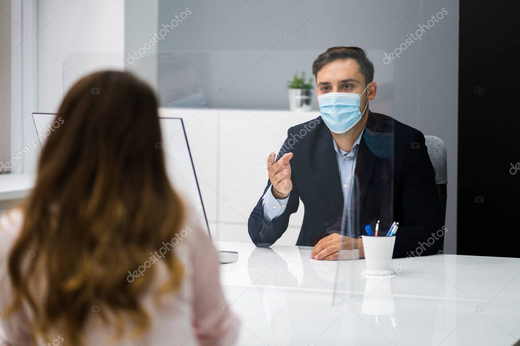 Young Woman Meeting Consultant Or Lawyer With Face Masks