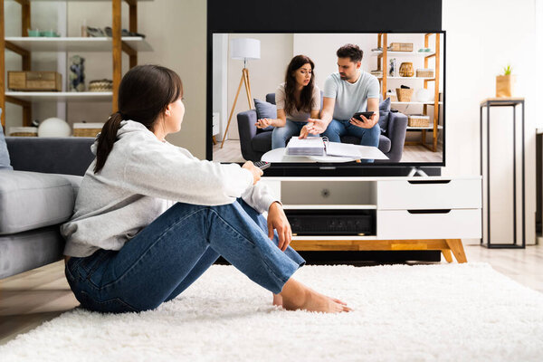 Woman Watching TV At Home. Television Movie