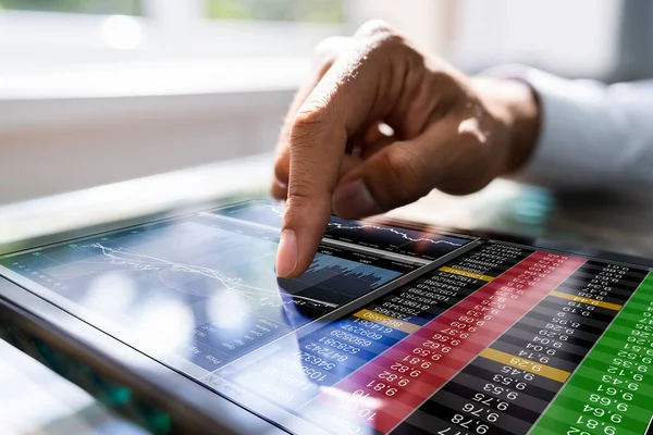 African Man Using Stock Market Data Tablet — Stock fotografie