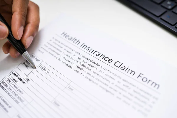 African American Writing Health Insurance Policy Paper — Photo