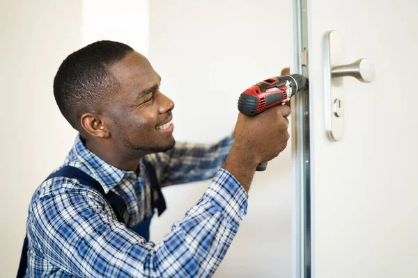 African Locksmith Man Changing Fixing Door Lock — Stock Photo, Image