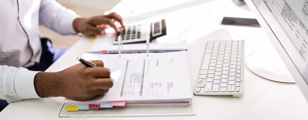 African American Accountant Doing Accounting And Tax