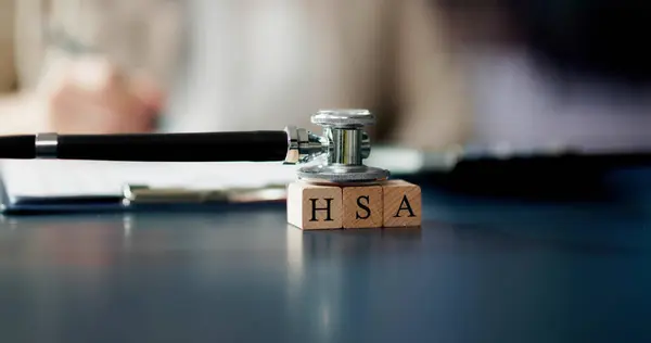 HSA Health Savings Account Wooden Blocks Near Stethoscope On Table