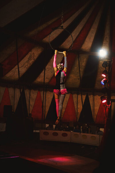 Cacak, Serbia - Jun 30, 2018: International circus called Corona, acrobat's play during night concert. 