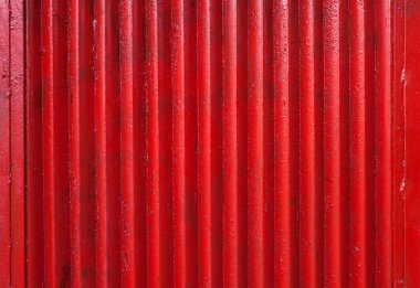 Nervürlü kırmızı metal çit, closeup görünümü dokusuna. 