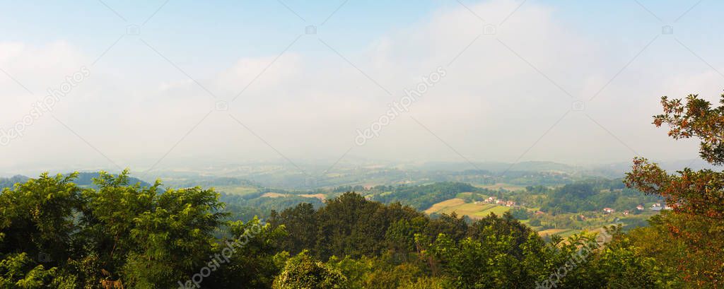 Serbian village Dragacevo, mountain Jelica, view on fields and meadows during summer season, early morning hours. 