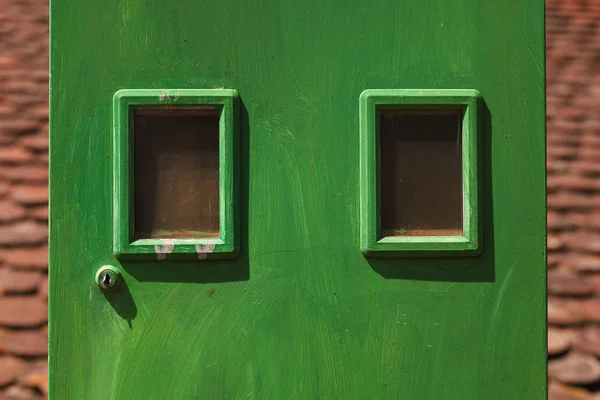 Details of a green electricity meters box, household equipment.