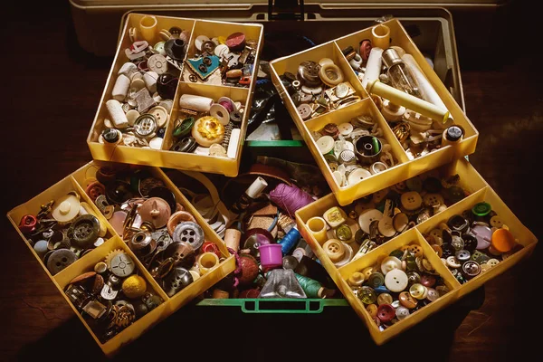 Closeup view of a container full of wear buttons.