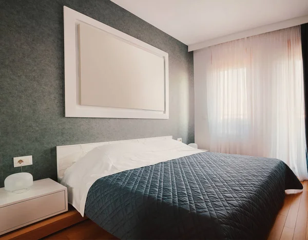 Interior of small hotel or home bedroom, modern furniture and room decor.