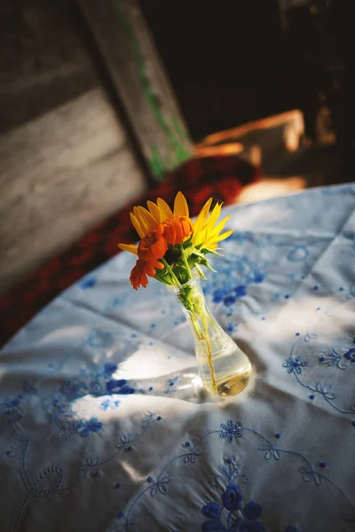 Beautiful Flowers in Glass Bottle