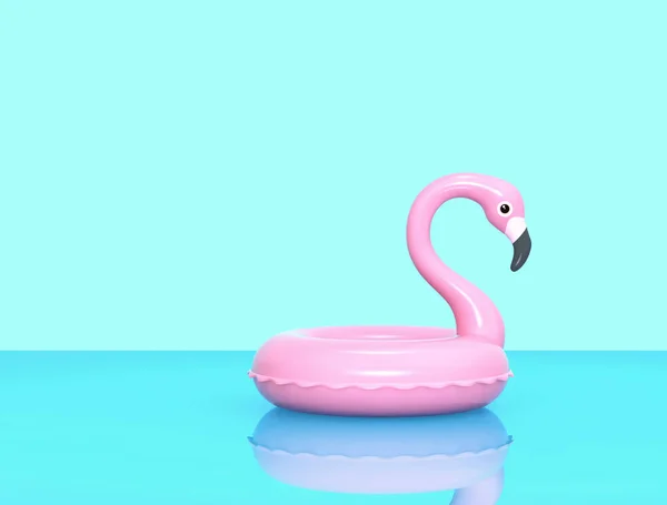 Aufblasbarer Flamingo auf blauer reflektierender Oberfläche — Stockfoto