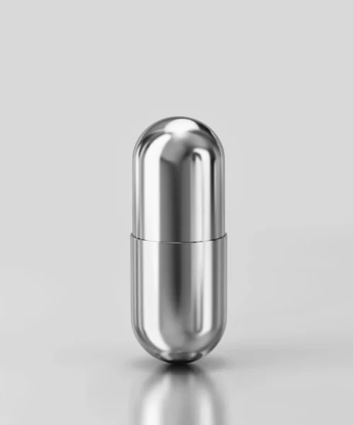 Silver capsule pill isolated on gray background. Clipping path i — Stock Photo, Image