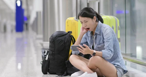 Woman Watching Video Cellphone Sitting Ground Airport — Stock Photo, Image
