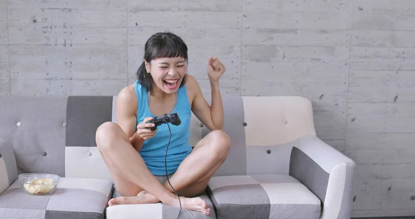 Woman play TV game at home