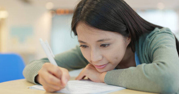 Student study on her exam at school