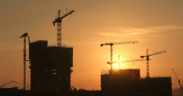 Sunset construction site in city