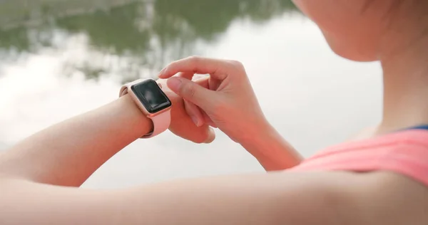 Woman record on smart watch for the sunning data