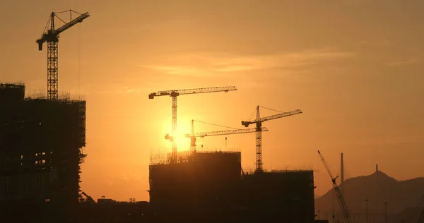 Silhouette of the construction site on sunset