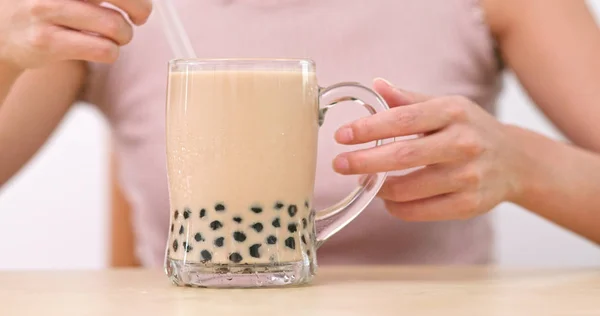 Woman drinking bubble milk tea