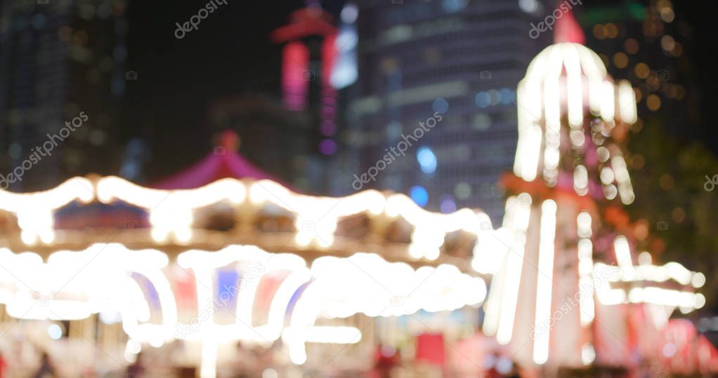 Blur view of carousel at night