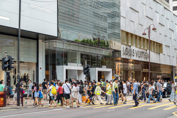 Tsim Sha Tsui, Hong Kong - 17 August, 2018: People crossing the road in Hong Kong city