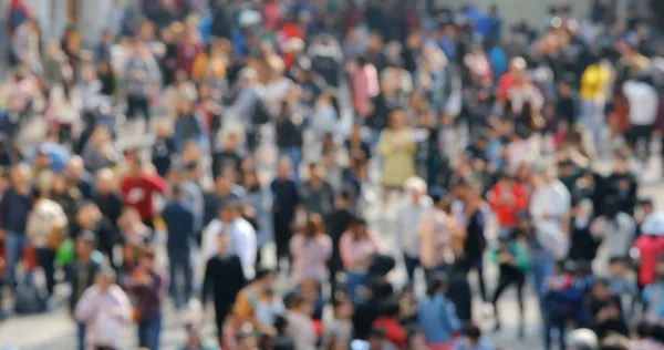 Bokeh of people walk in the street