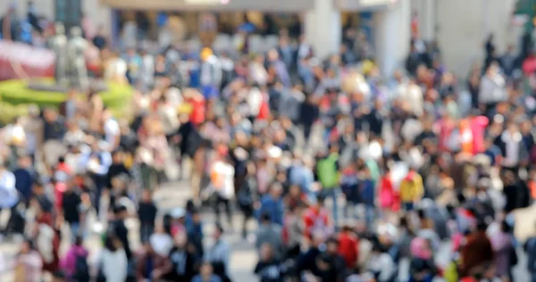 Bokeh of people walk in the street