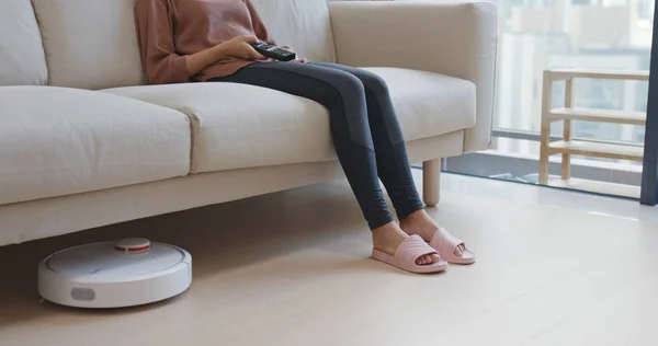 Woman Lift Feet Letting Vacuum Pass Though Stock Picture