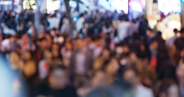 Blur view of People cross the road at night