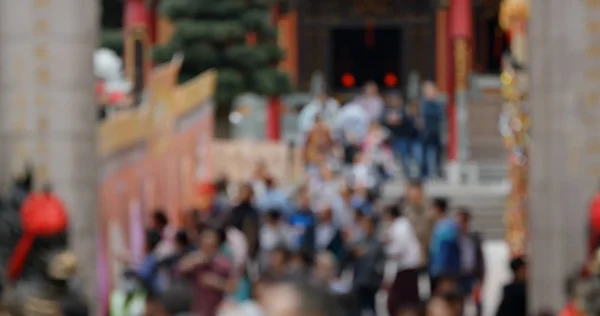 Blur of people visit chinese temple