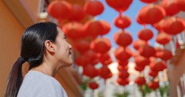 Woman enjoy look at the red lanterns