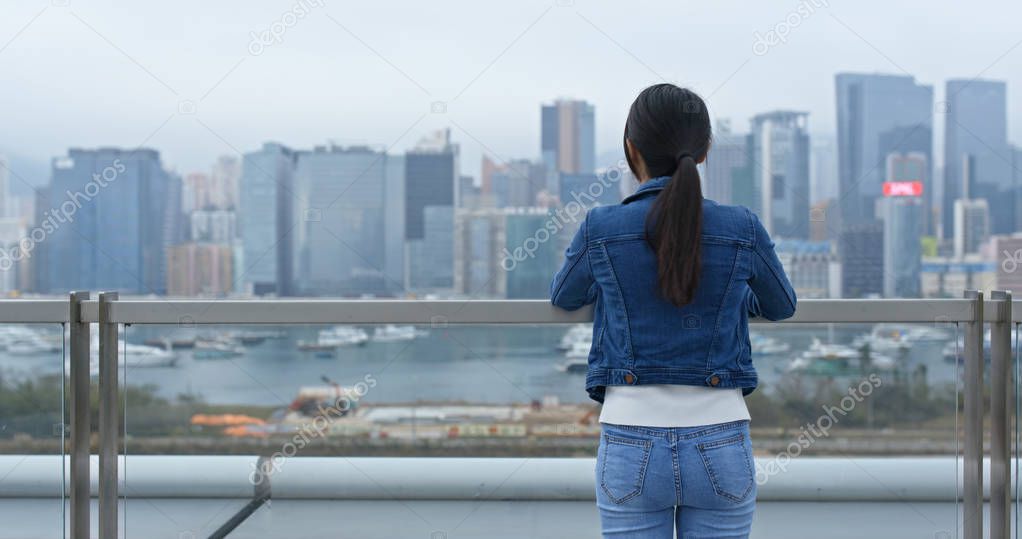 Woman look around the city view