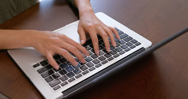 Woman work on notebook computer at home