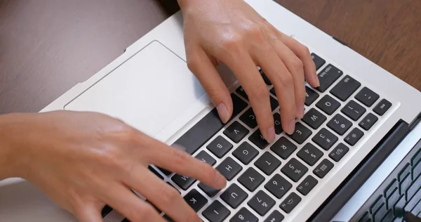 Woman work on notebook computer at home