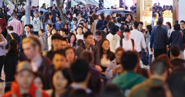 Causeway Bay, Hong Kong - 22 February, 2019: Crowded of People cross the road at night