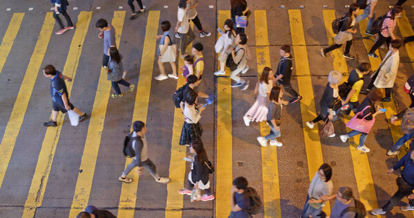 Mong Kok, Hong Kong - 21 March, 2019: Top view people walk in the street at night