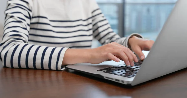 Woman type on laptop computer