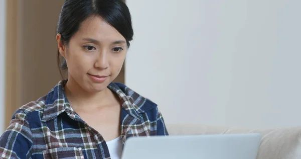 Woman check on computer at home