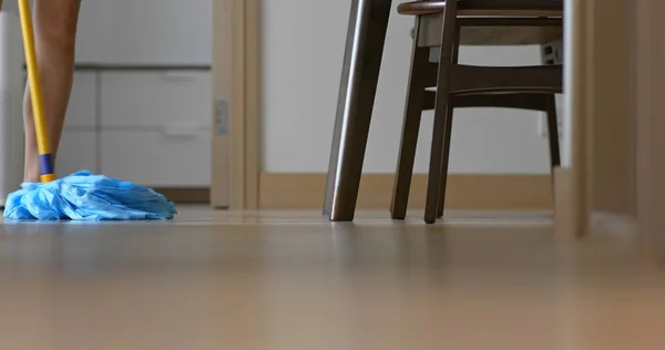 Housewife clean floor with mop