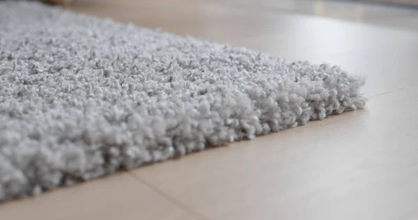 Grey carpet on the floor at home