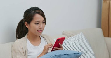 Woman check on smart phone at home
