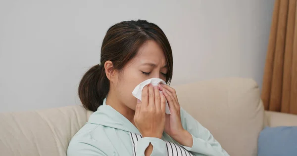 Woman feel sick and sneeze at home — Stock Photo, Image