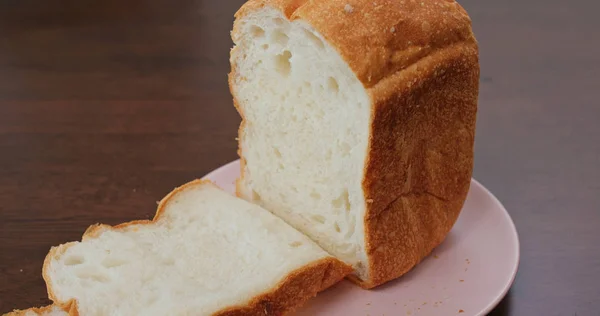 Cut a homemade white bread — Stock Photo, Image