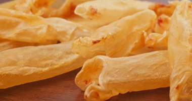 Dried fish maw close up clipart