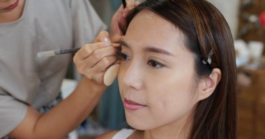 Female model having make up in the beauty salon