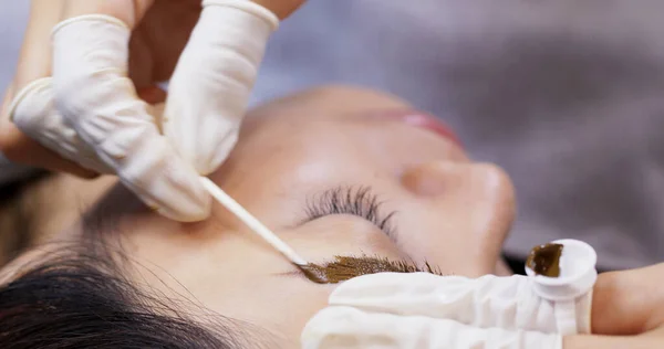 Microblading procedure, master work on woman eyebrow