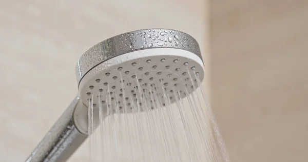 Water flow from shower head in bathroom — 스톡 사진