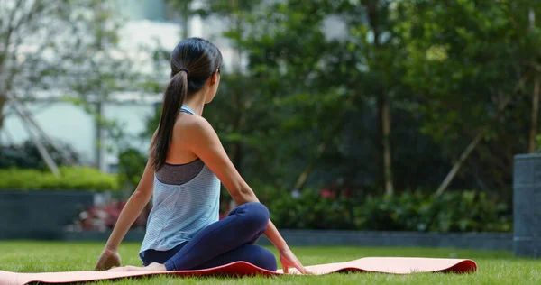 Woman do yoga at the park — 스톡 사진