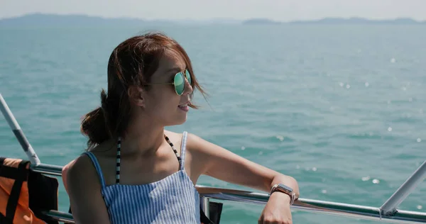 Woman wear sunglass on boat trip